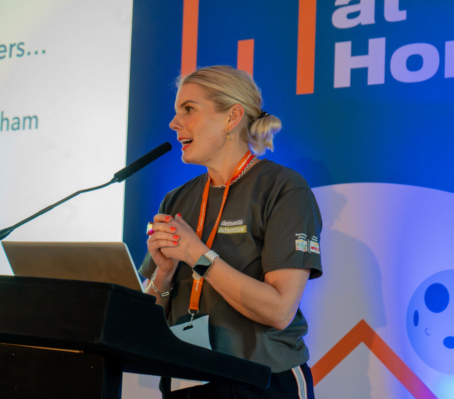 susie cery from dementia adventure helps present award at homecare conference