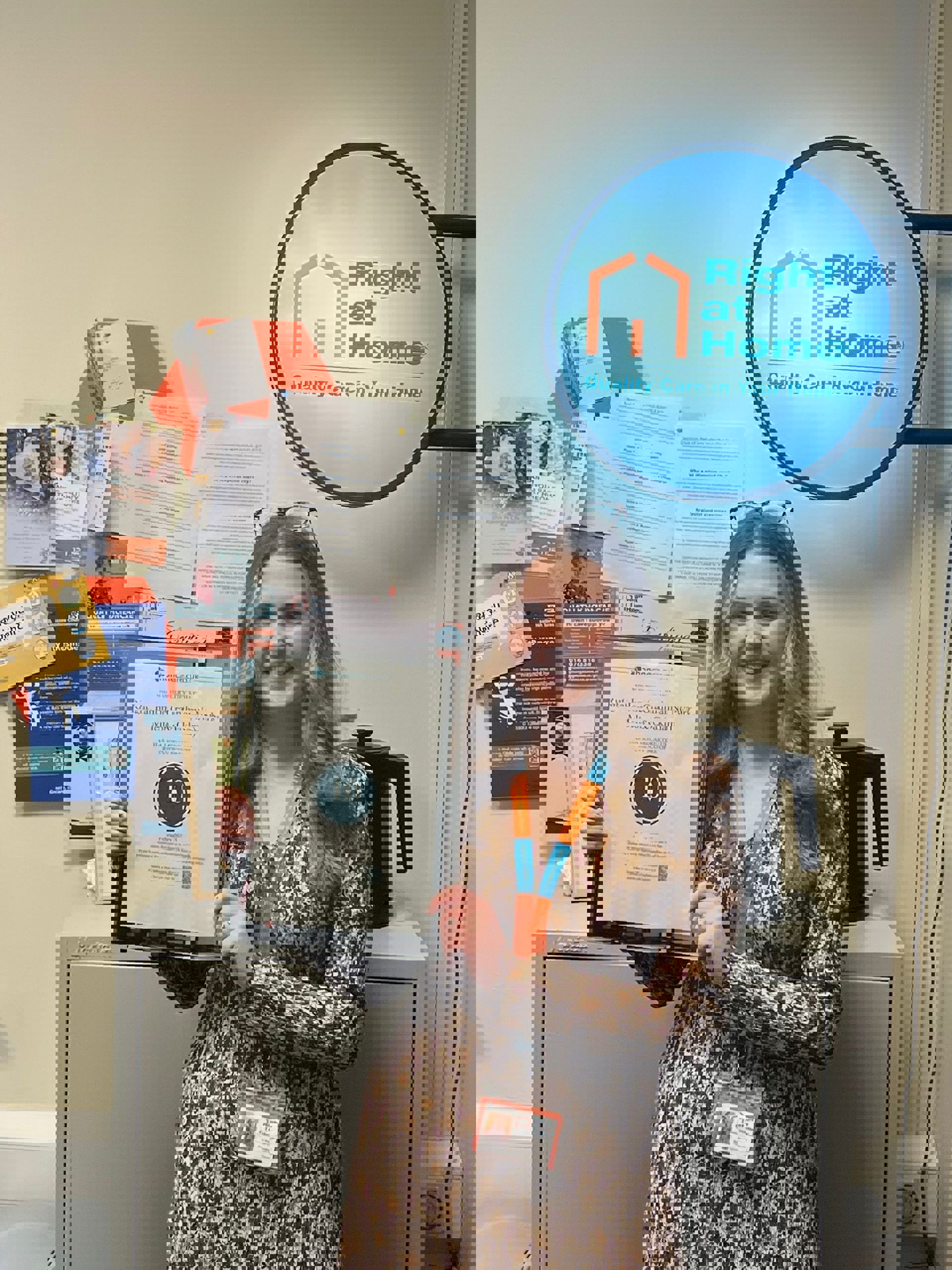 Billie holding homecare award in Right at Home office