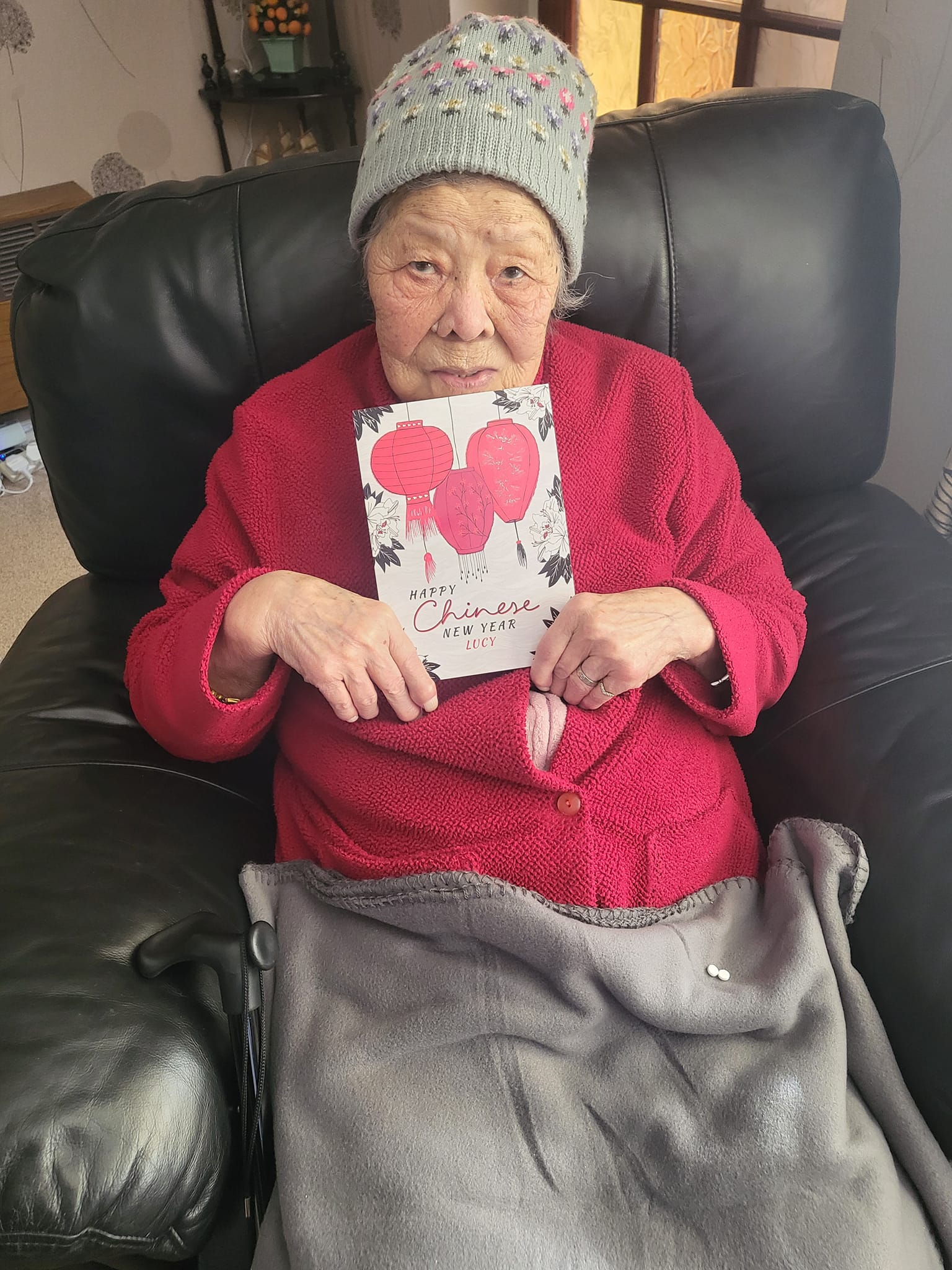 Lucy,  a client at Right at Home Portsmouth recieving a Chinese New Year card