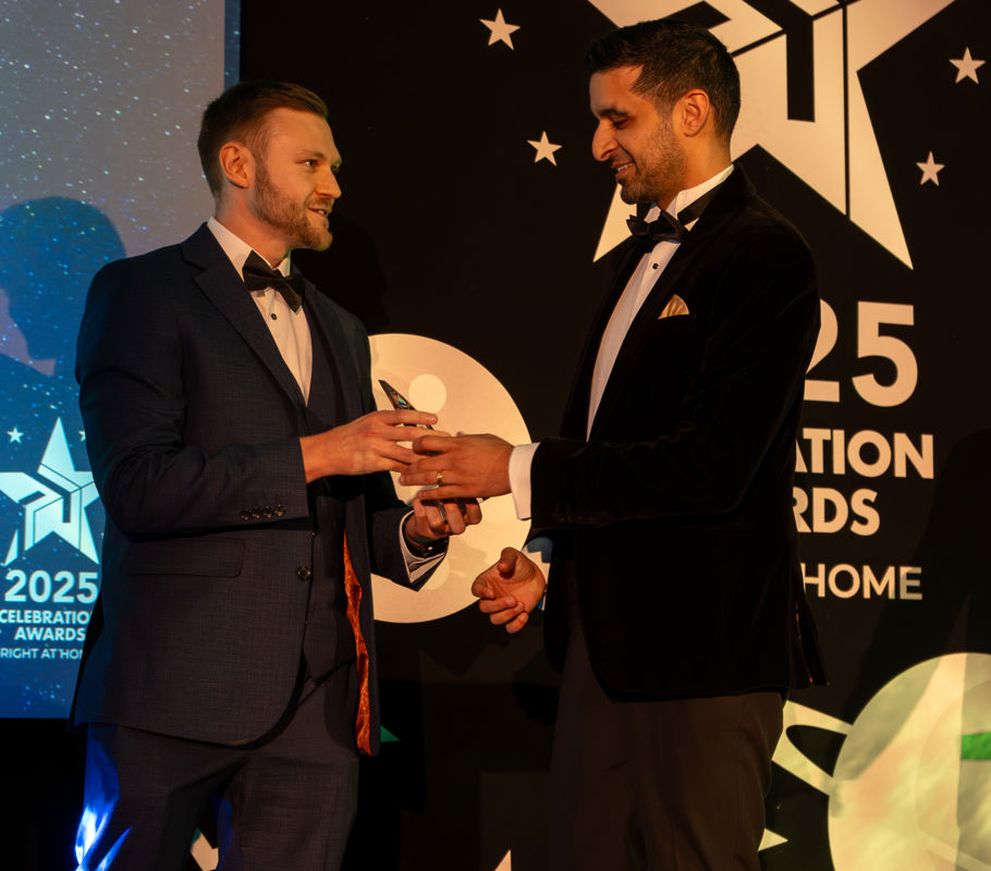 homecare franchise owner collects award at conference