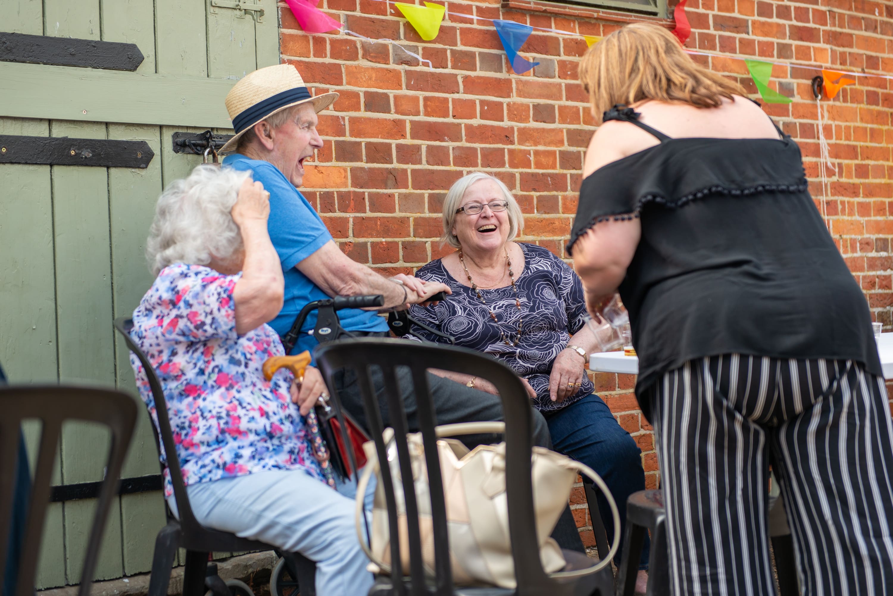 Clients And Caregivers Laughing Together