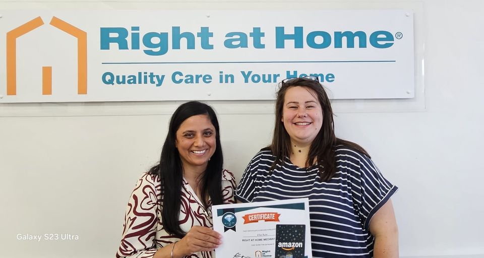 Image of Registered Manager presenting an award