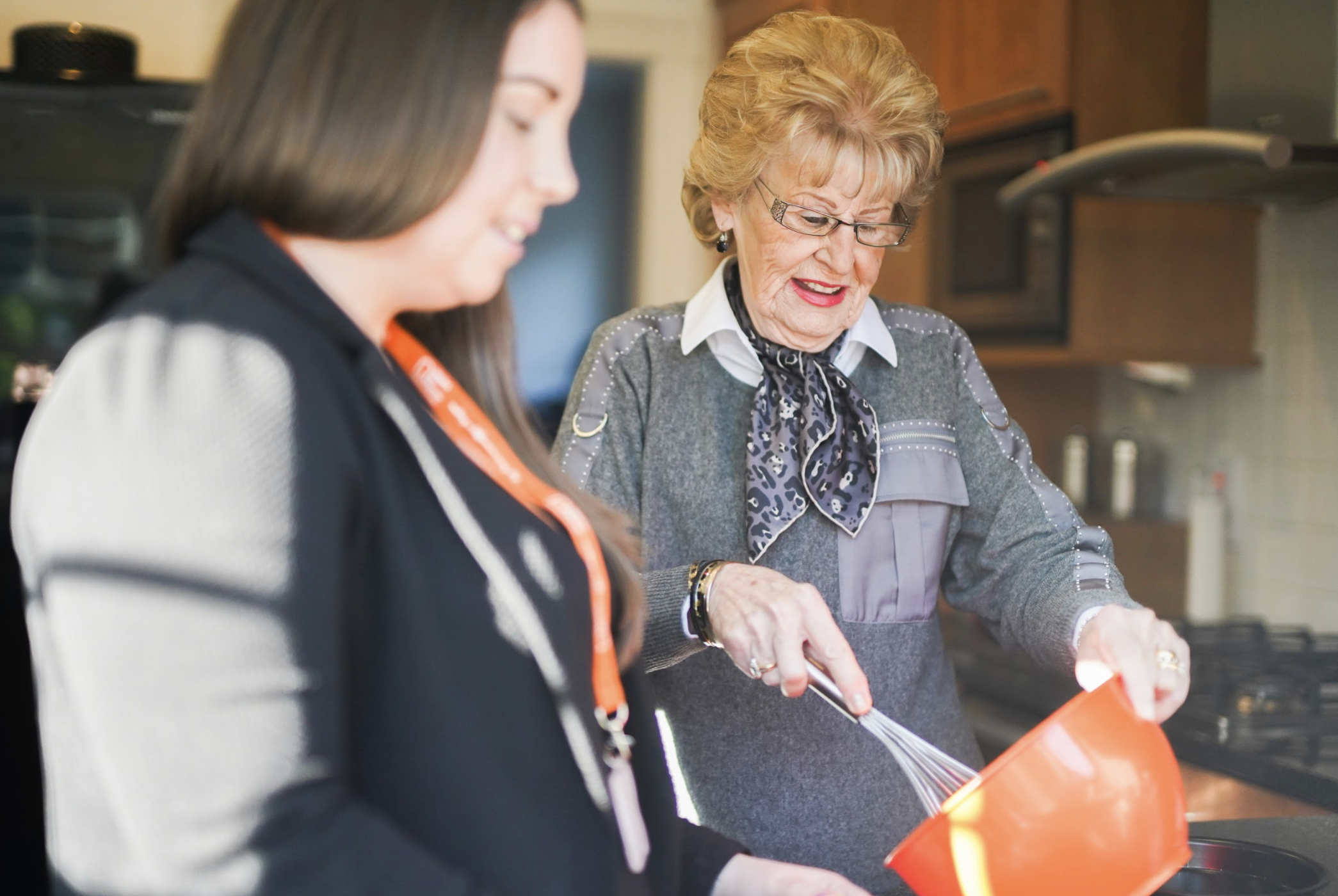 Client and CareGiver Baking in Kitchen