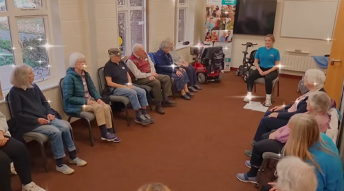 Care worker leads Love 2 Move Class at Right at Home Worthing helping people living with dementia to stay active