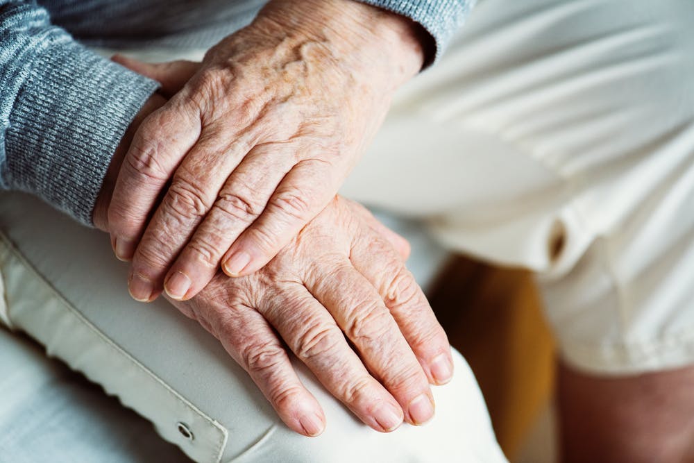 Elderly Couple Holding Hands