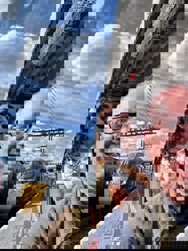 Carer and client on a business trip stood next to a train