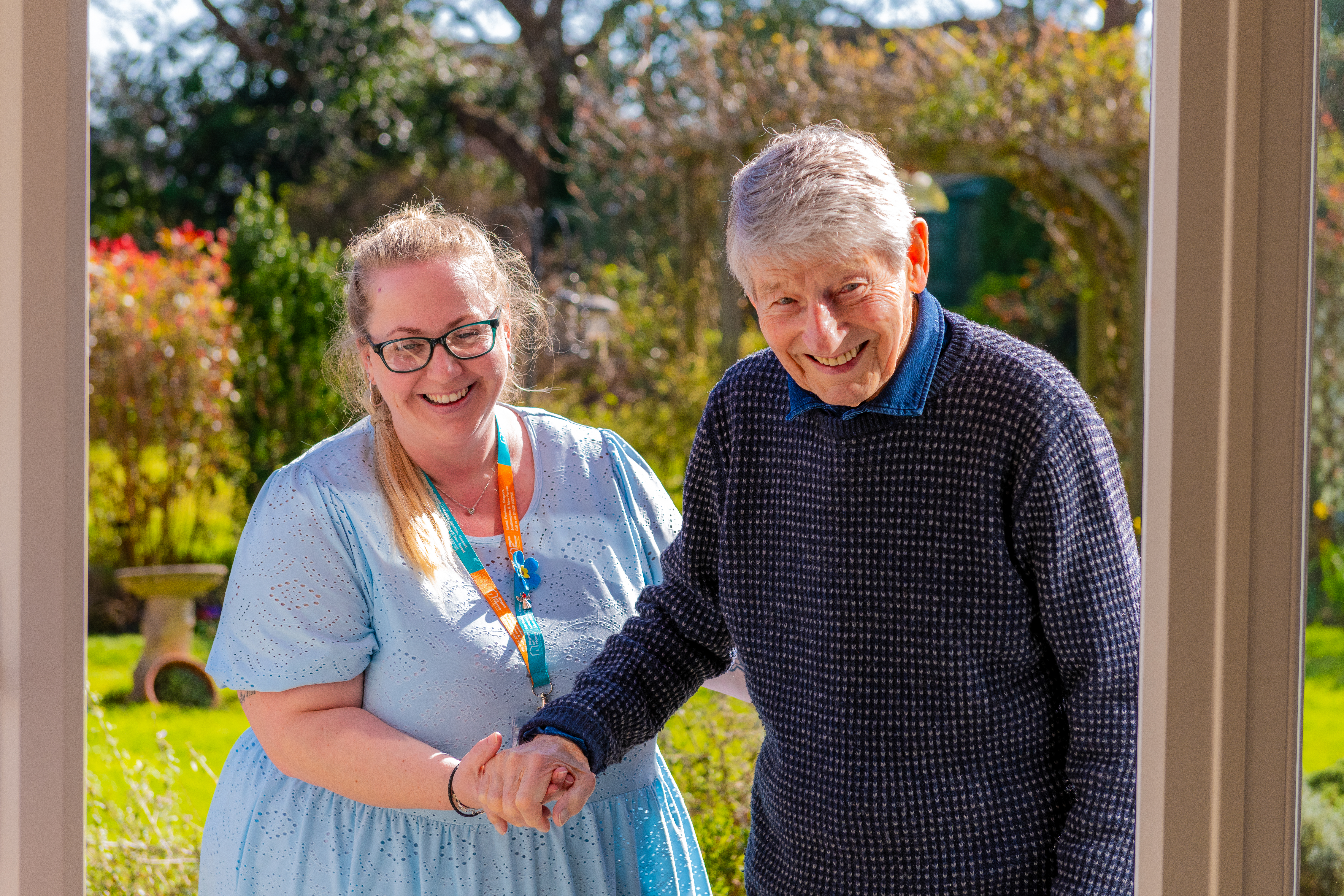 Carer and Client together smiling.
