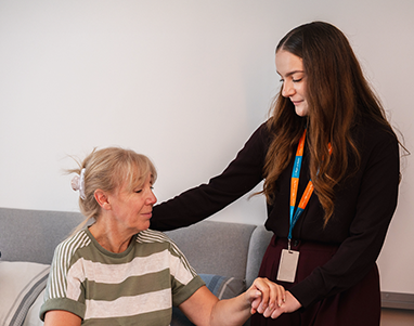 Carer supporting an older adult at home with continuous 24-hour care