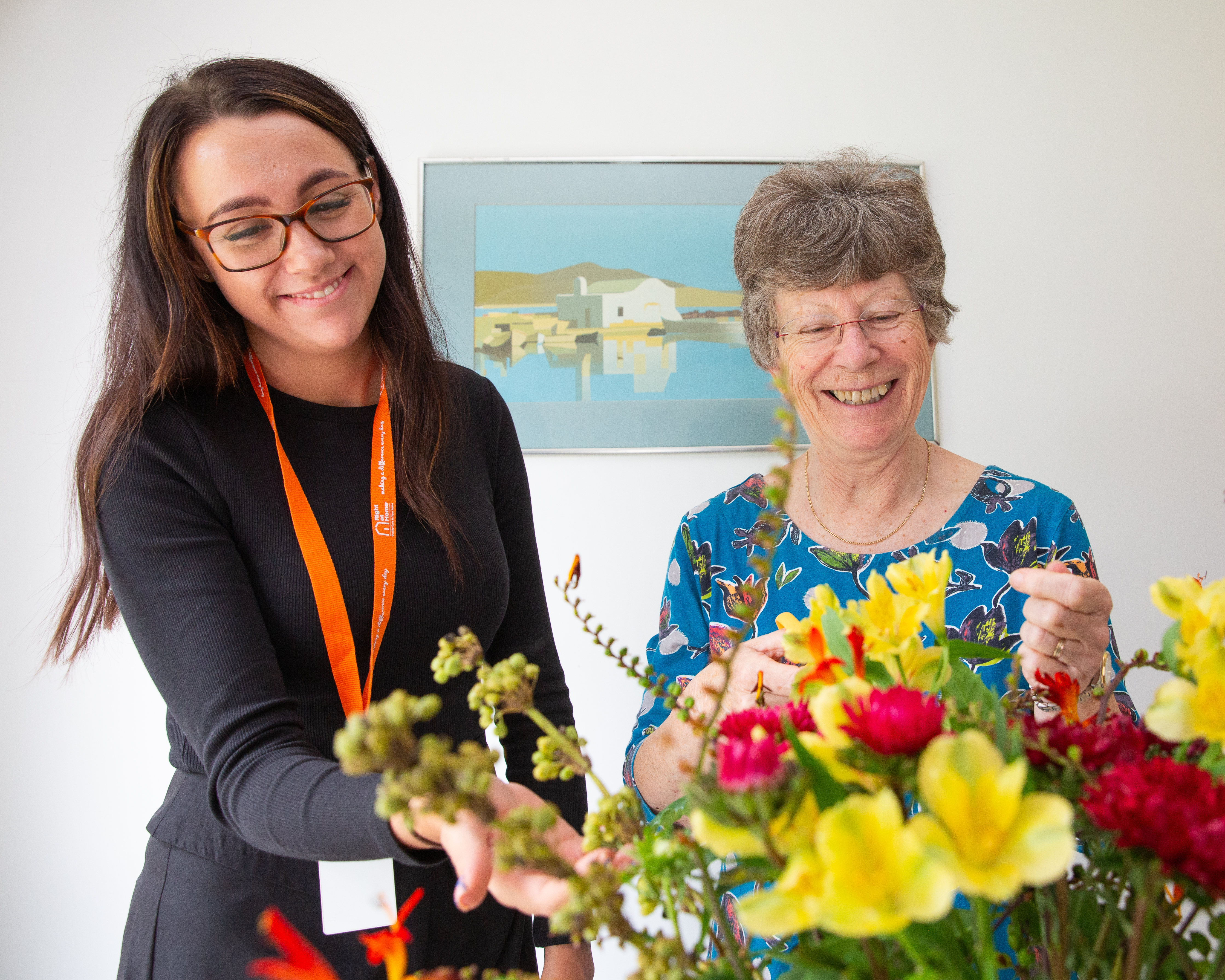 CareGiver and Client arranging flowers together
