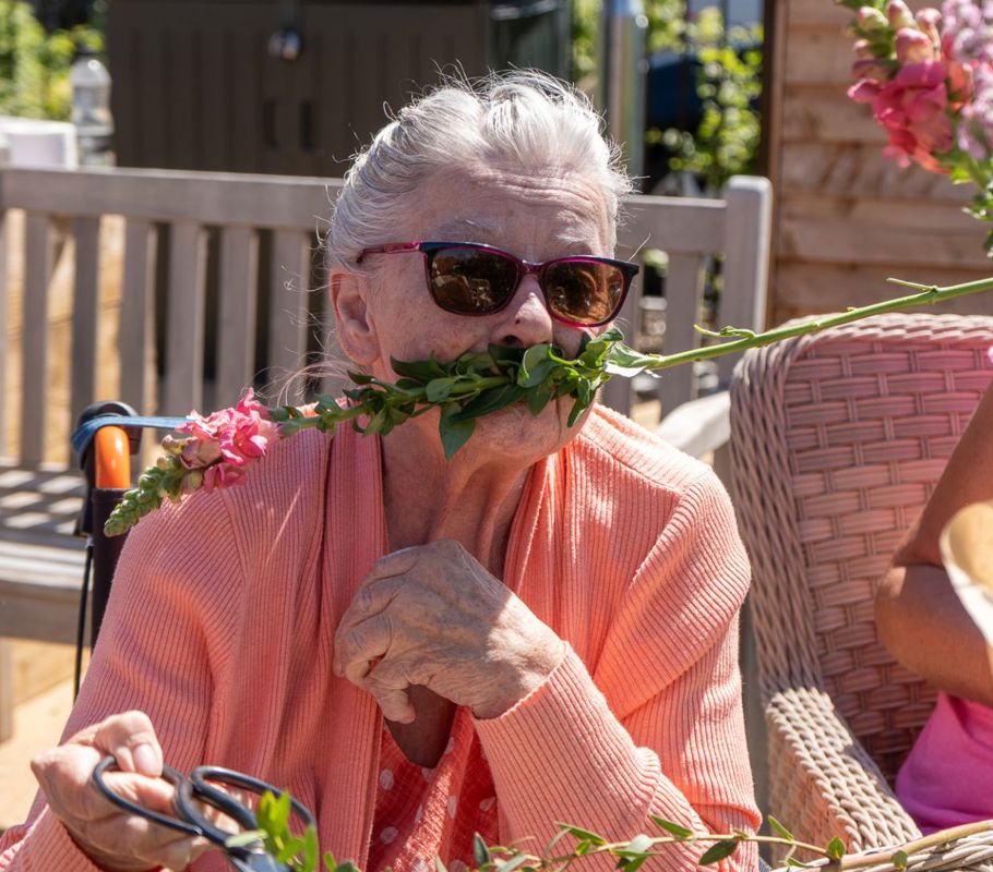 client with rose at picnic