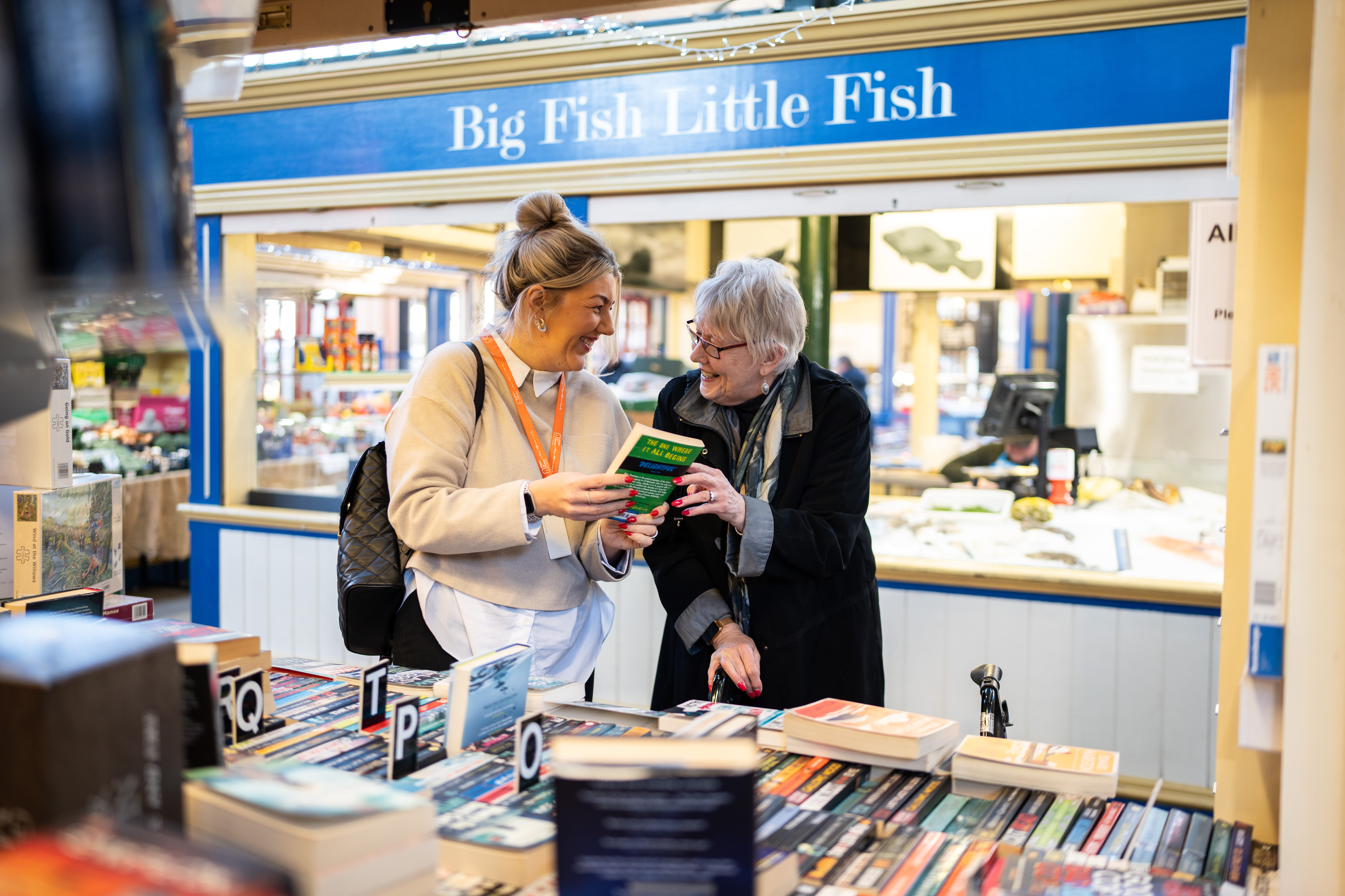 Carer and Client book shopping.