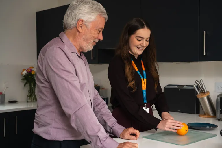 Client and Carer preparing fruit as a snack