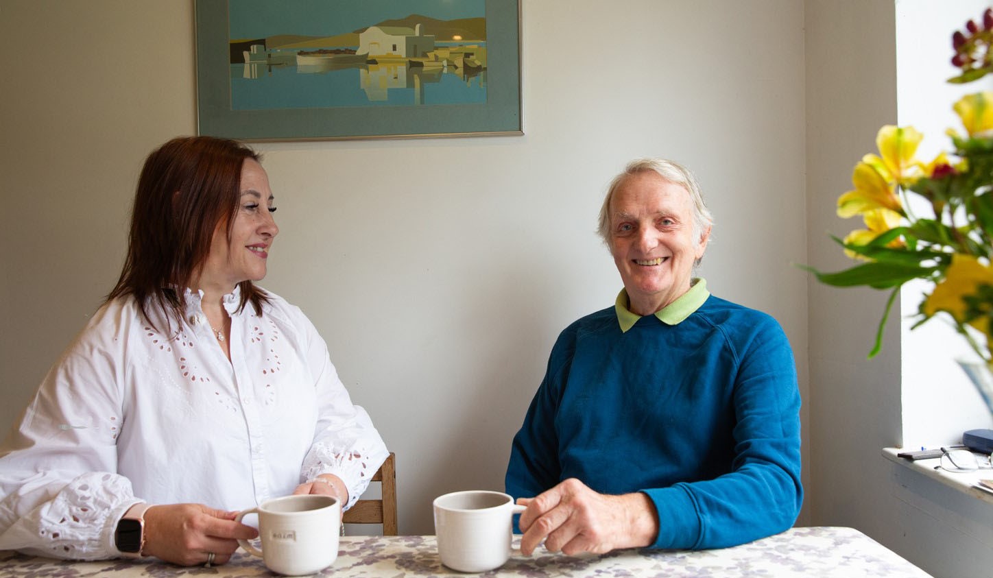 client and caregiver enjoy cup of tea