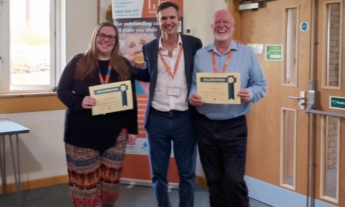 Becky and Mark receive their 8 year's service certificates from Duncan Cameron, Owner/Director.