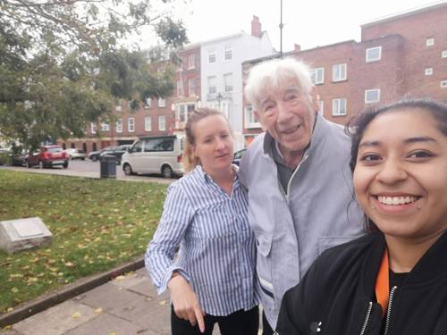 Two Right at Home Portsmouth Care Workers working together to take a client out