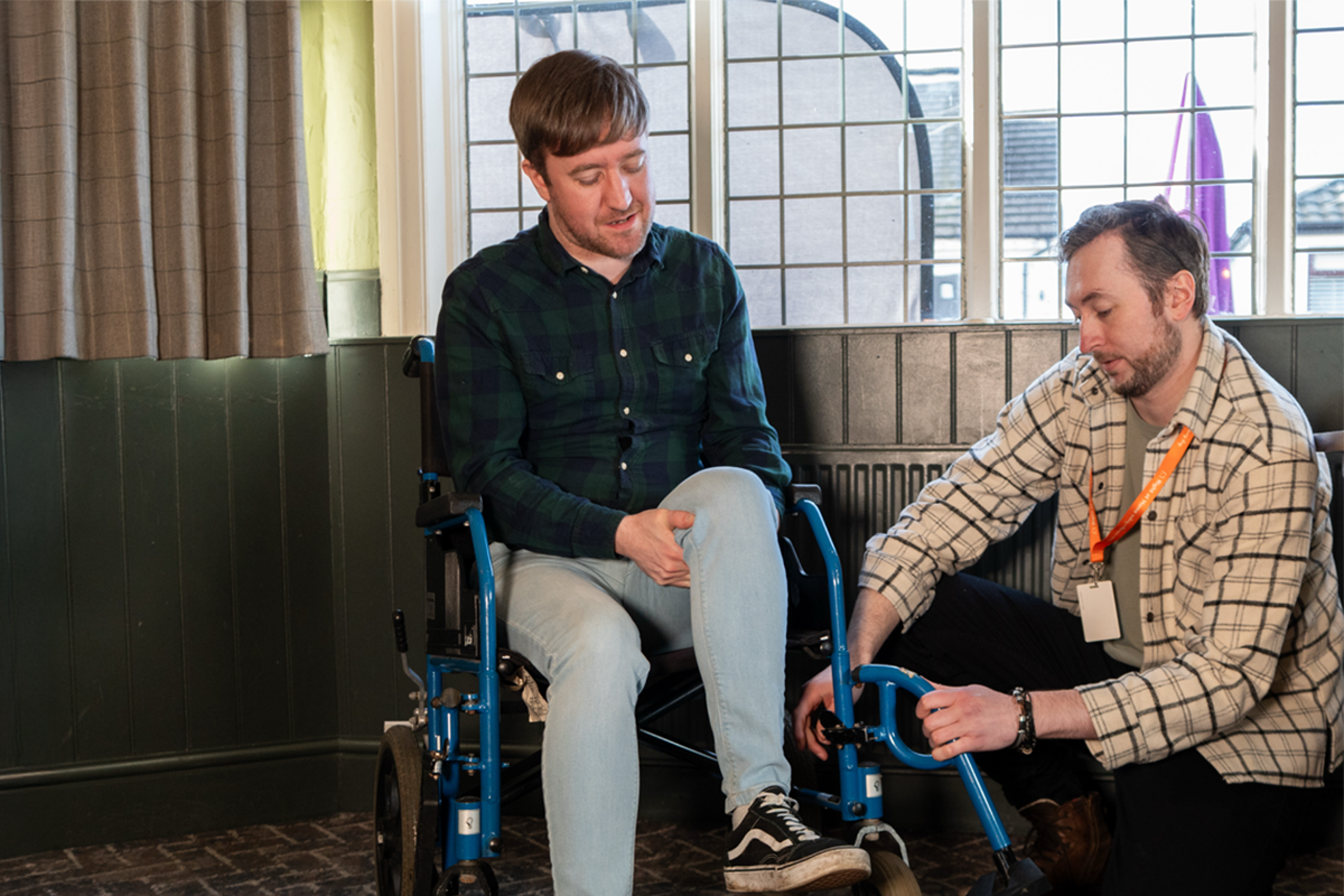 Our Client being supported by a Carer to enjoy a day out at the local community hub