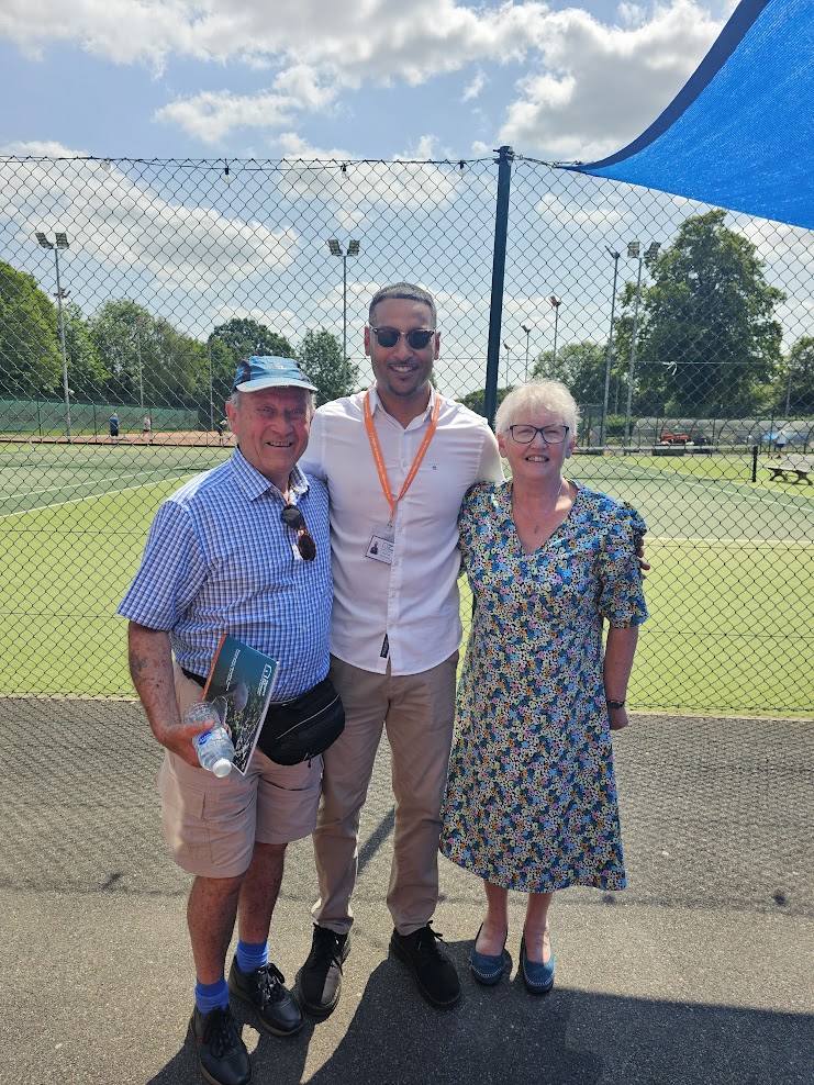 clients and community enjoying picnic at tennis club