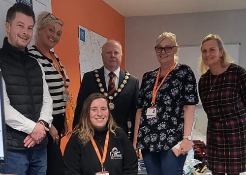 Team members from Right at Home Bishops Stortford welcoming the Mayor to the office when they organised a collection for Ukraine