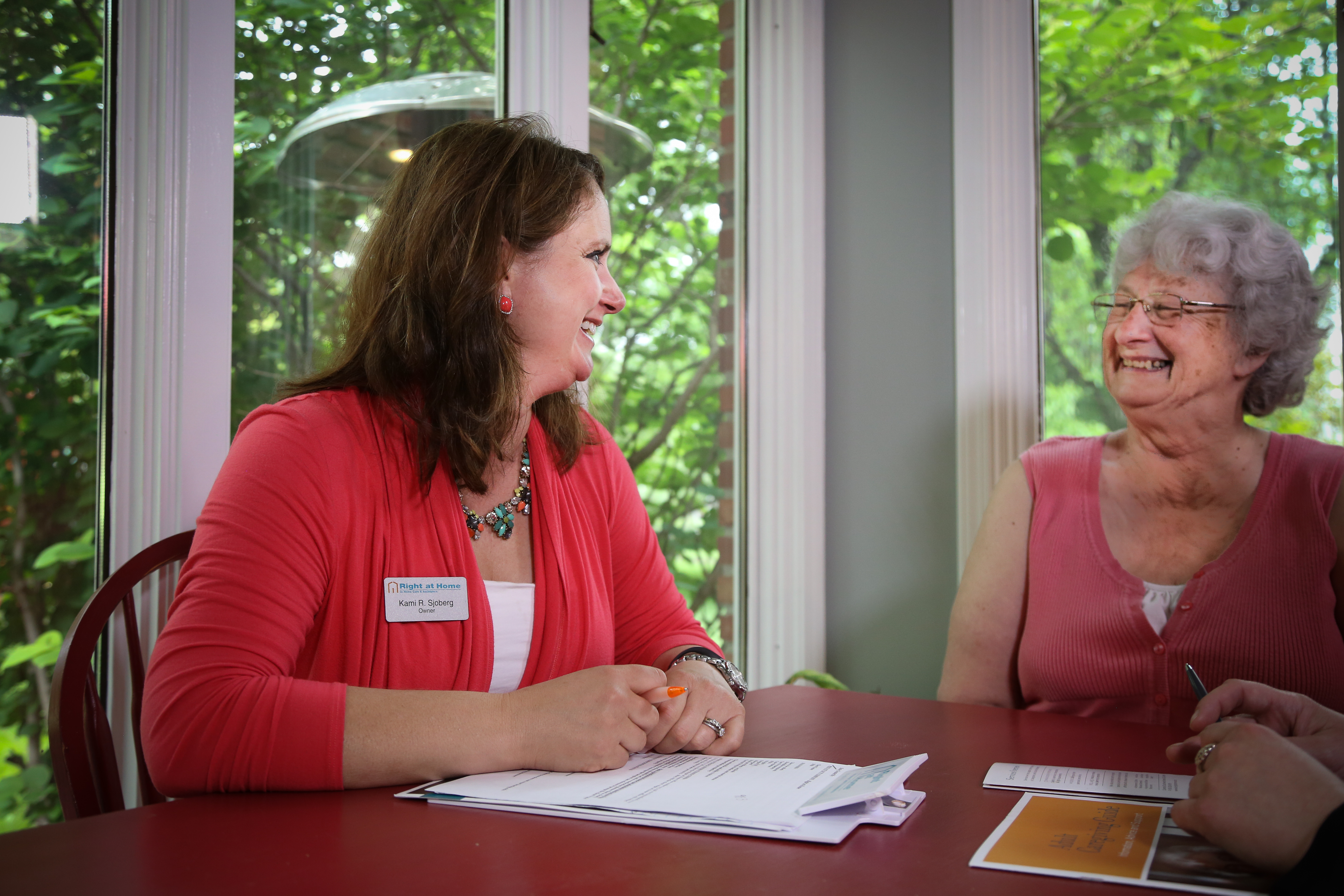 homecare client and caregiver filling out assessment forms